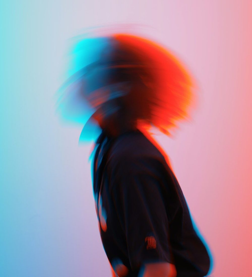 A blurry photo of a person with a skateboard